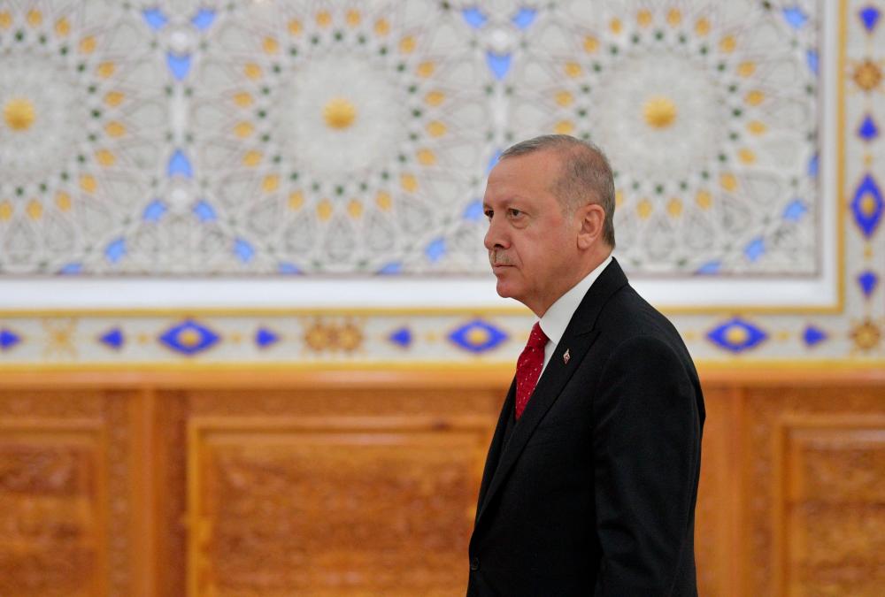 Turkish President Recep Tayyip Erdogan walks to attend the Conference on Interaction and Confidence-Building Measures in Asia (CICA) in Dushanbe on June 15, 2019. — AFP