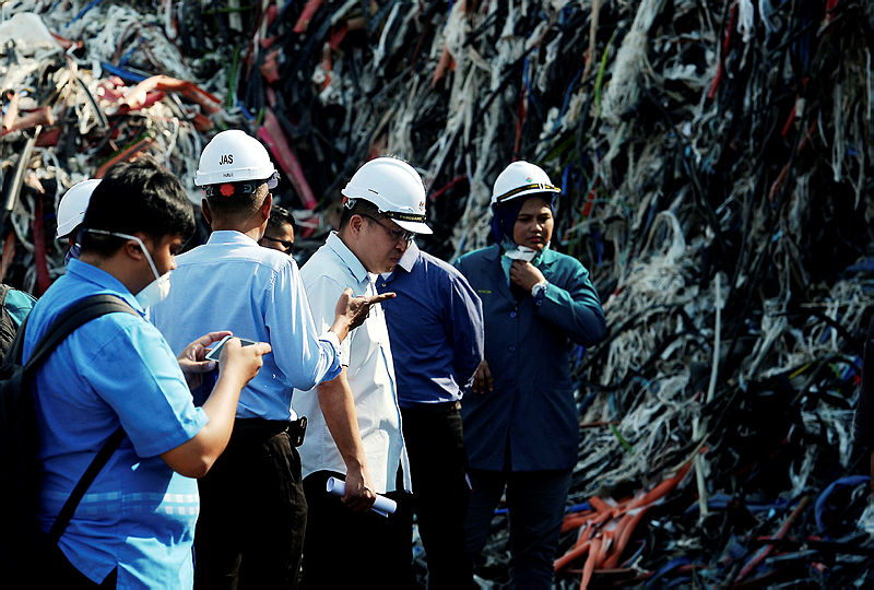 Johor Local Government, Urban Wellbeing and Environment Committee chairman Tan Chen Choon (3rd L) during a visit to a plastic factory in Pasir Gudang on July 29, 2019. — Bernama