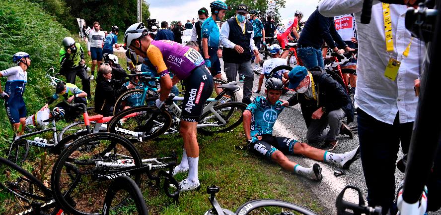 In this file photo taken on June 26, 2021 riders are helped by medical staff members during the 1st stage of the 108th edition of the Tour de France cycling race, 197 km between Brest and Landerneau. The spectator who caused the biggest pile-ups in Tour de France 2021 has been on Dec 9, 2021. – AFPPIX
