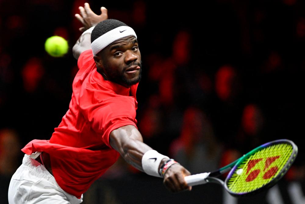 USA’s Frances Tiafoe of Team World returns the ball to Serbia’s Novak Djokovic of Team Europe during their 2022 Laver Cup men’s singles tennis match at the O2 Arena in London on September 24, 2022. AFPPIX