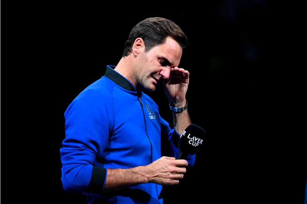 Switzerland's Roger Federer sheds a tear during an interview after playing his final match, a doubles with Spain's Rafael Nadal of Team Europe against USA's Jack Sock and USA's Frances Tiafoe of Team World in the 2022 Laver Cup at the O2 Arena in London, early on September 24, 2022. - AFPPIX