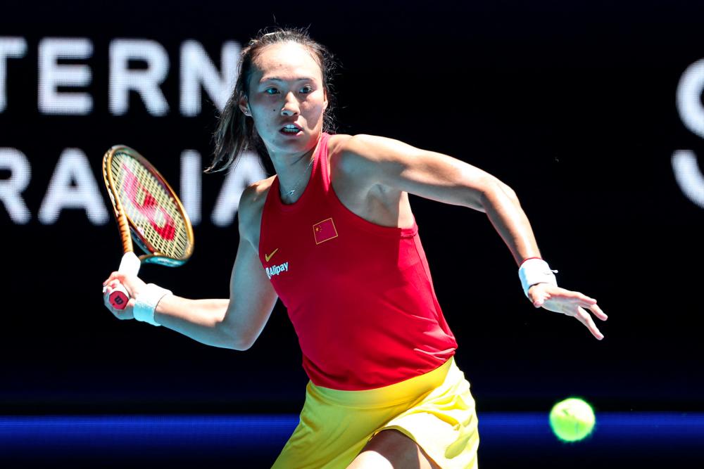 China’s Zheng Qinwen hits a return against Czech Republic’s Marketa Vondrousova during their women's singles match at the United Cup tennis tournament in Perth on December 30, 2023. - AFPPIX