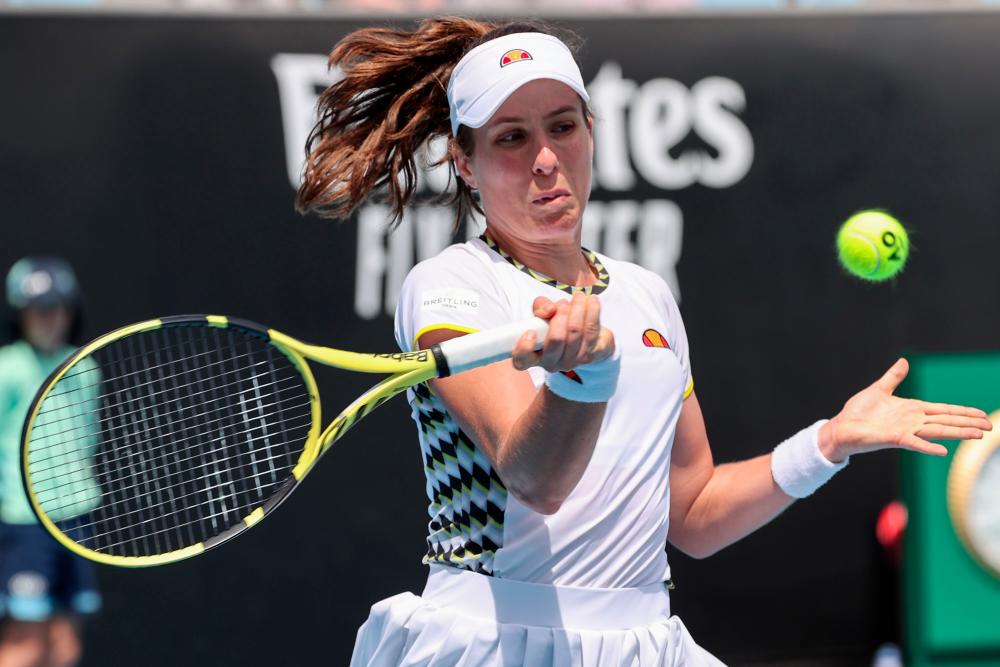 Britain's Johanna Konta hits a return against Tunisia's Ons Jabeur during their women's singles match on day two of the Australian Open tennis tournament in Melbourne on Jan 21. — AFP