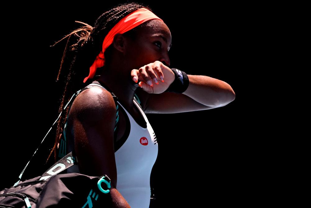 Coco Gauff of the US leaves after a defeat against Latvia’s Jelena Ostapenko after their women’s singles match on day seven of the Australian Open tennis tournament in Melbourne on January 22, 2023. AFPPIX