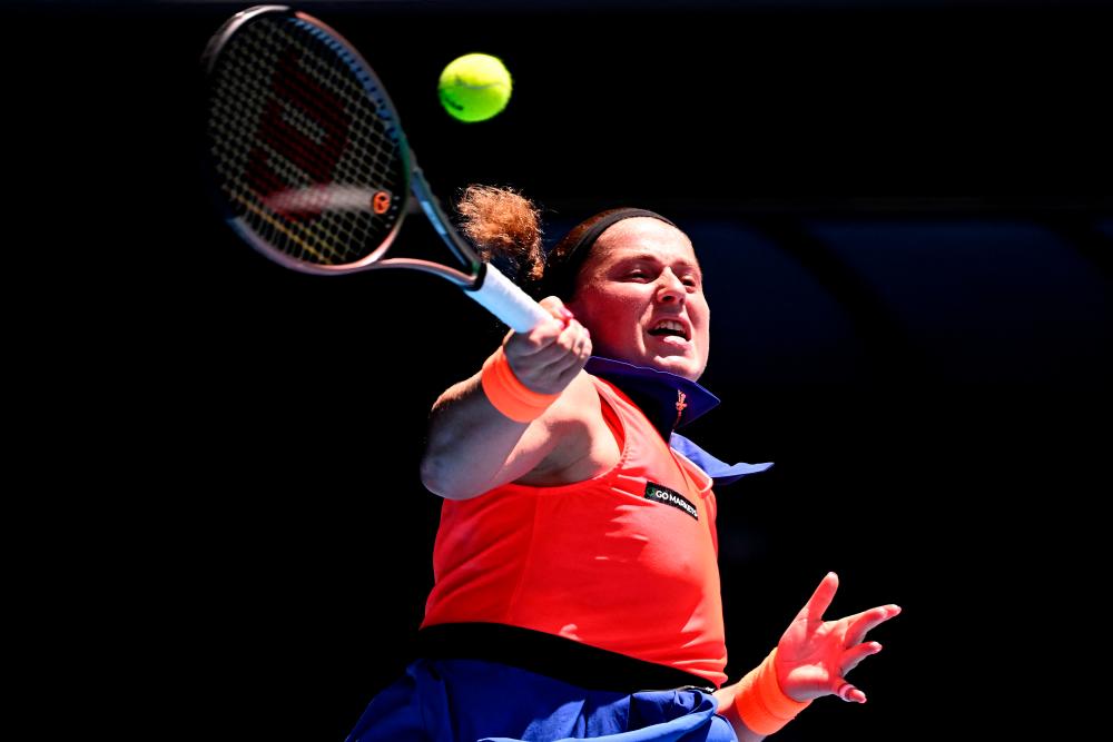 Latvia’s Jelena Ostapenko hits a return against Coco Gauff of the US during their women’s singles match on day seven of the Australian Open tennis tournament in Melbourne on January 22, 2023. AFPPIX