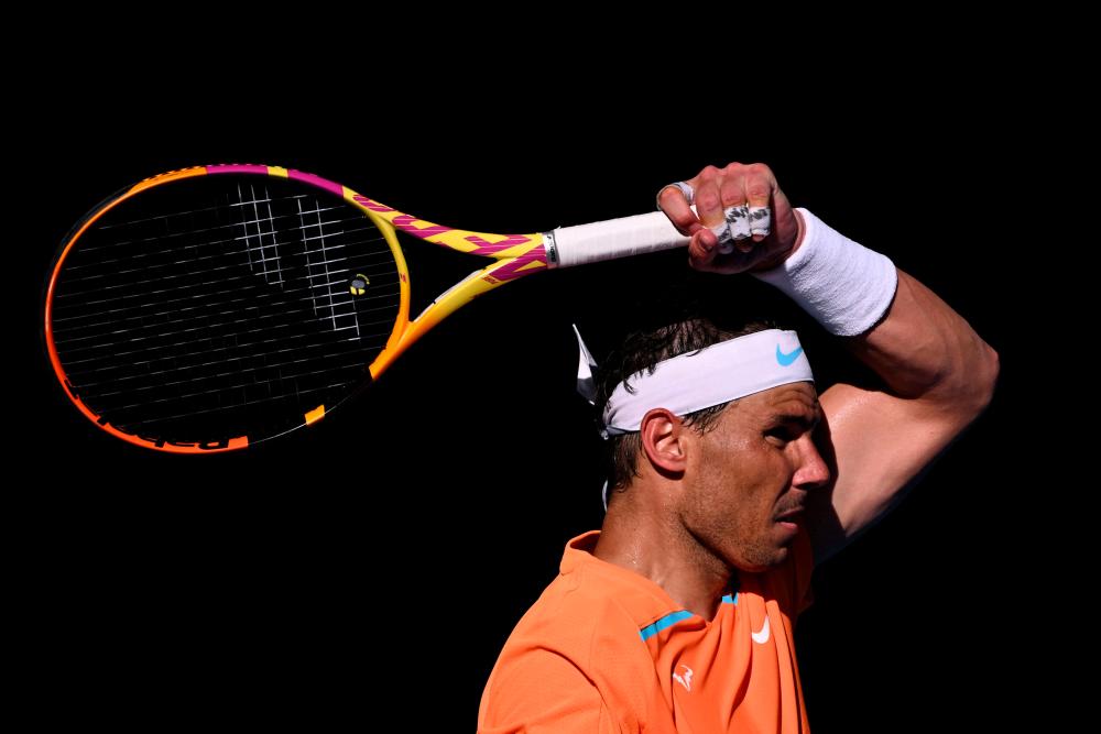 Spain's Rafael Nadal returns to Britain's Jack Draper during their men's singles match on day one of the Australian Open tennis tournament in Melbourne on January 16, 2023/AFPPix