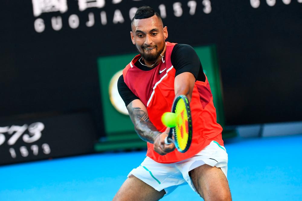 Australia’s Nick Kyrgios hits a return against Russia’s Daniil Medvedev during their men’s singles match on day four of the Australian Open tennis tournament in Melbourne on January 20, 2022. AFPPIX
