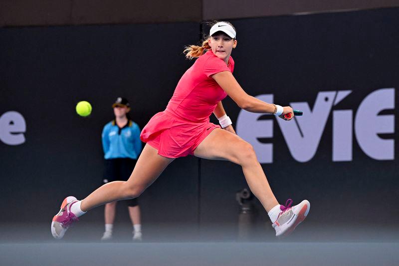 Mirra Andreeva of Russia hits a return during her women's singles quarter-final match against Ons Jabeur of Tunisa at the Brisbane International tennis tournament in Brisbane on January 3, 2025. - AFPPIX