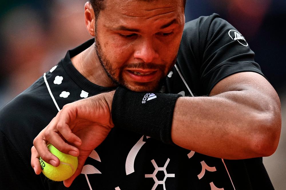 France's Jo-Wilfried Tsonga reacts after losing against Norway's Casper Ruud at the end of their men's singles match on day three of the Roland-Garros Open tennis tournament at the Court Philippe-Chatrier in Paris on May 24, 2022. AFPPIX
