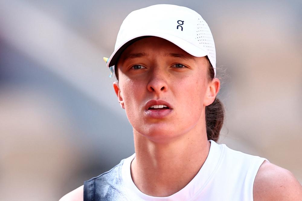 Poland’s Iga Swiatek looks on during her match against Spain’s Cristina Bucsa during their women’s singles match on day three of the Roland-Garros Open tennis tournament at the Court Philippe-Chatrier in Paris on May 30, 2023/AFPPix