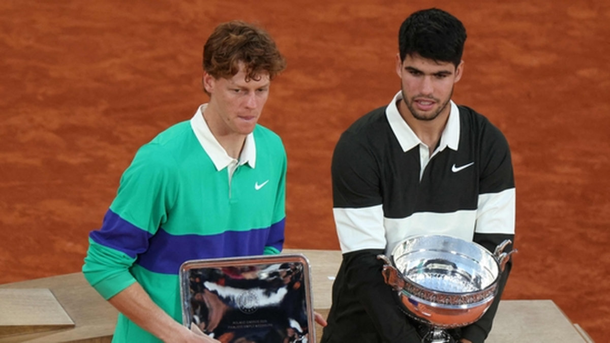 Winner Spain’s Carlos Alcaraz (R) and finalist Italy’s Jannik Sinner pose with their respective trophies. - AFPpix