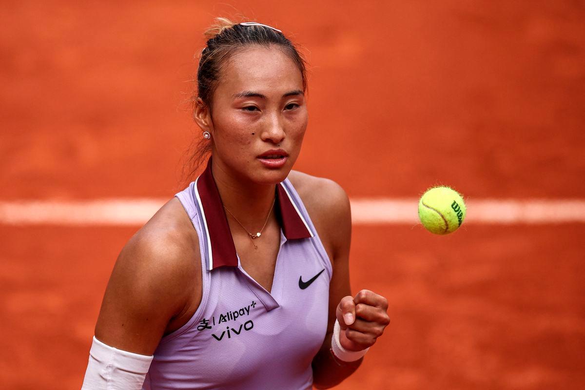 China’s Zheng Qinwen reacts after a point during her women’s singles match against Russia’s Liudmila Samsonova on day 8 of the French Open tennis tournament on Court Suzanne-Lenglen at the Roland-Garros Complex in Paris on June 1, 2025. (Photo by Anne-Christine POUJOULAT / AFP)