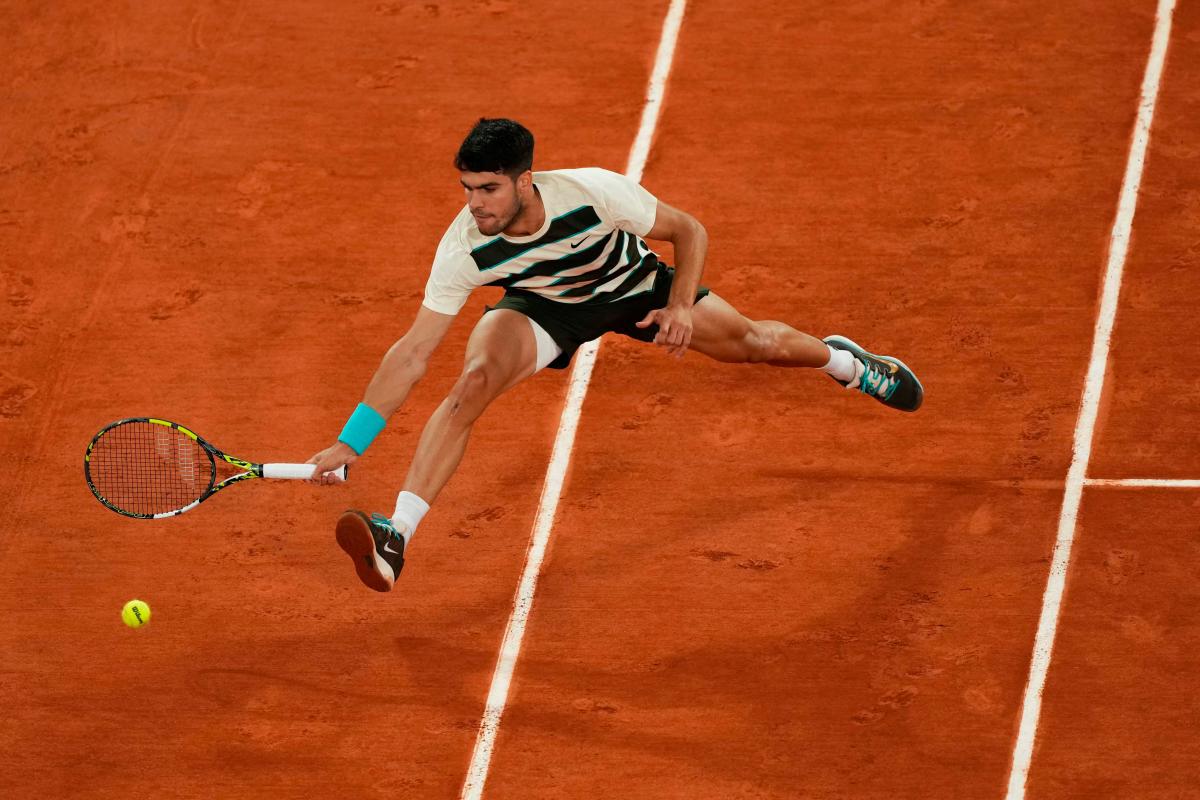 Spain’s Carlos Alcaraz plays a forehand return to Italy’s Lorenzo Musetti during their men’s singles semi-final match on day 13 of the French Open tennis tournament on Court Philippe-Chatrier at the Roland-Garros Complex in Paris on June 6, 2025. AFP