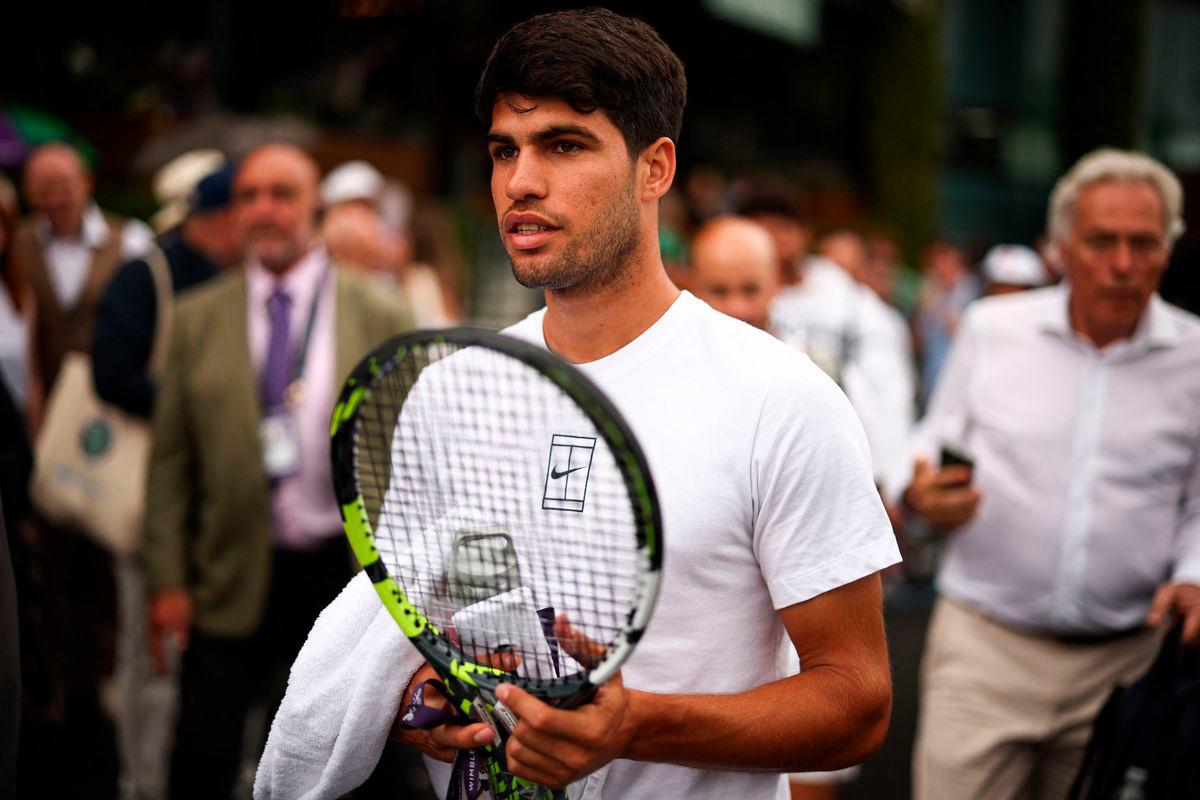 Spain’s Carlos Alcaraz arrives for a training session ahead of his men’s singles second round tennis match against Britain’s Oliver Tarvet on the third day of the 2025 Wimbledon Championships at The All England Lawn Tennis and Croquet Club in Wimbledon, southwest London, on July 2, 2025- AFP
