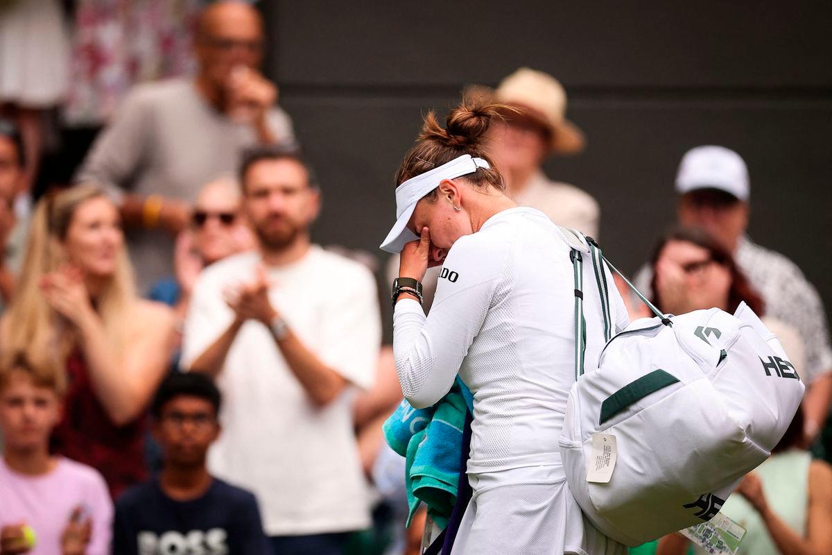 Czech Republic’s Barbora Krejcikova cries as she leaves Court 1 following her defeat against USA’s Emma Navarro at the end of their women’s singles third round tennis match on the sixth day of the 2025 Wimbledon Championships at The All England Lawn Tennis and Croquet Club in Wimbledon, southwest London, on July 5, 2025 -AFP
