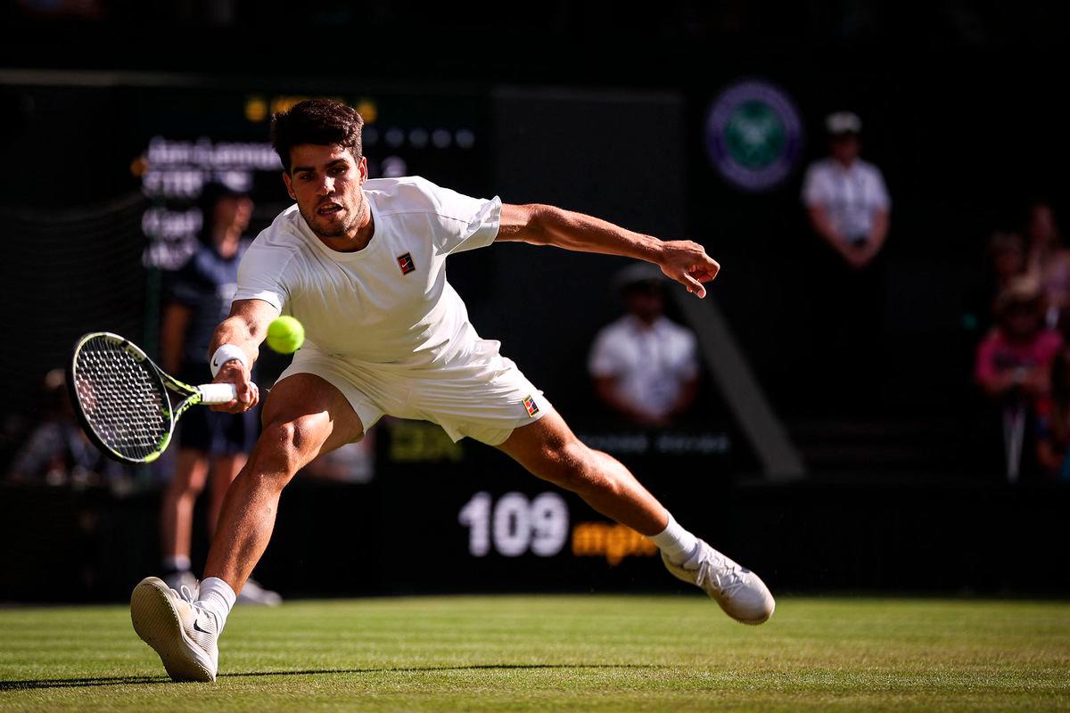 Spain’s Carlos Alcaraz plays a forehand return to Germany’s Jan-Lennard Struff during their men’s singles third round tennis match on the fifth day of the 2025 Wimbledon Championships at The All England Lawn Tennis and Croquet Club in Wimbledon, southwest London, on July 4, 2025- AFP