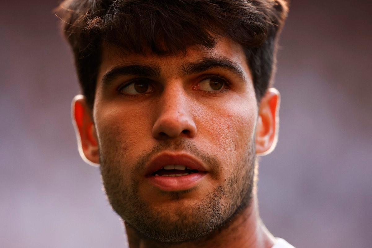 Spain’s Carlos Alcaraz reacts as he plays against Germany’s Jan-Lennard Struff during their men’s singles third round tennis match on the fifth day of the 2025 Wimbledon Championships at The All England Lawn Tennis and Croquet Club in Wimbledon, southwest London, on July 4, 2025- AFP