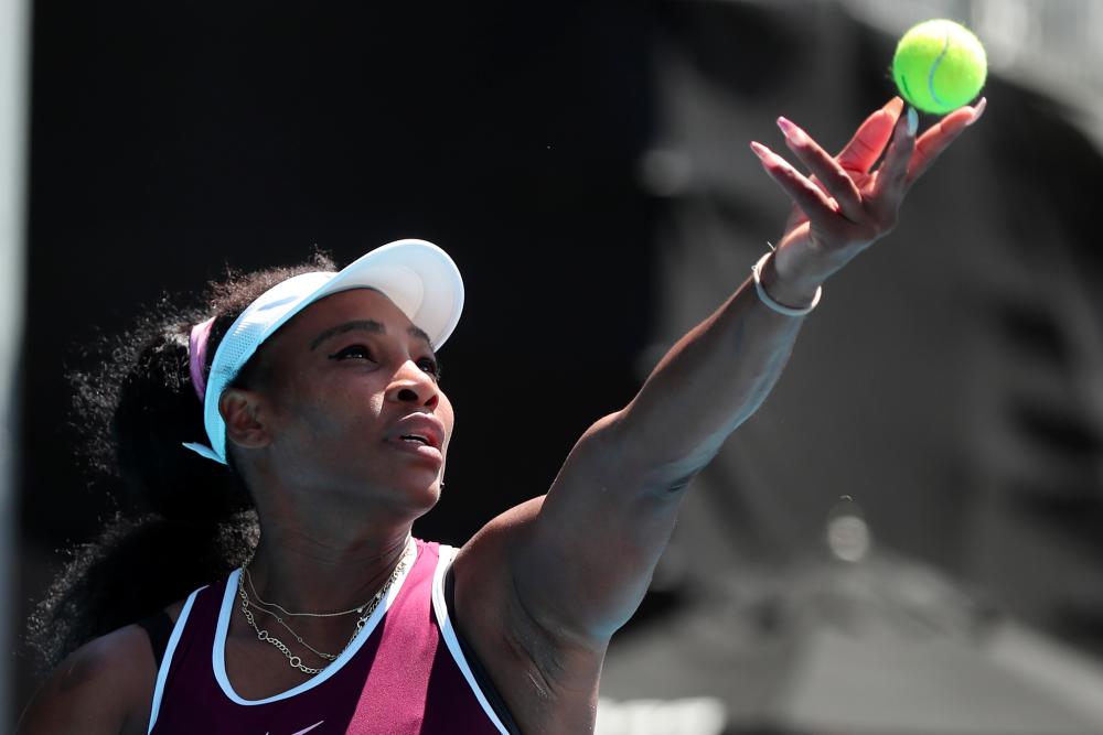 Serena Williams of the US serves against Christina McHale of the US during their women's singles second round match during the Auckland Classic tennis tournament in Auckland on Jan 9. — AFP