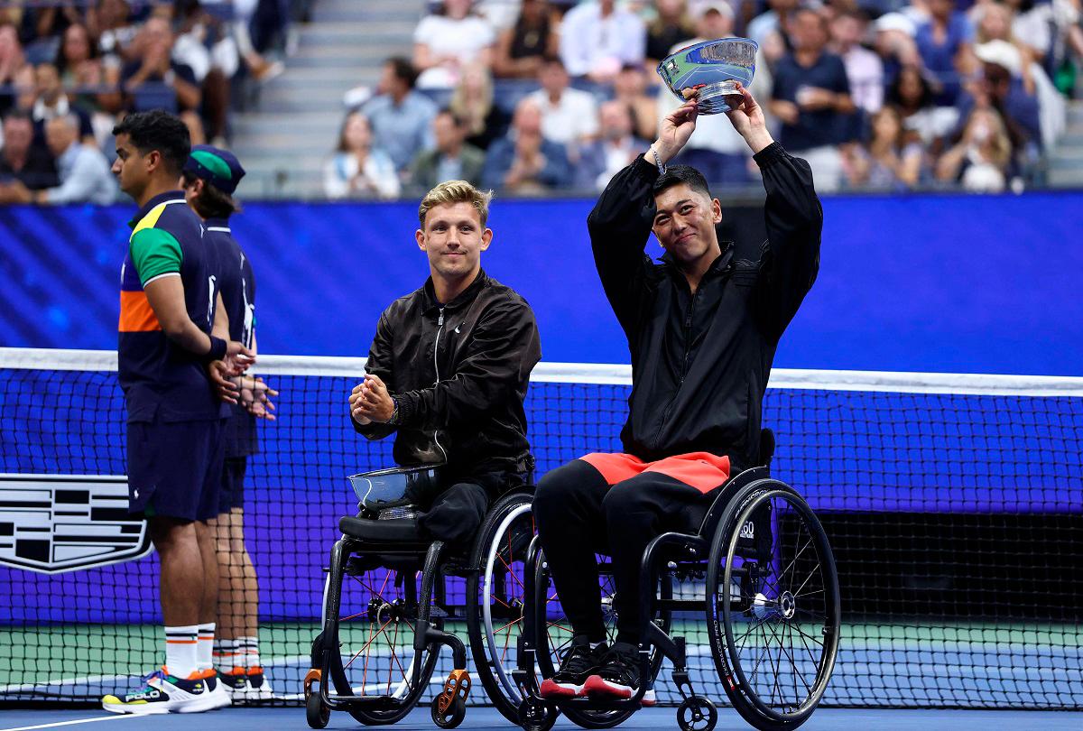 Japan’s Tokito Oda holds his trophy next to runner-up Gustavo Fernandez of Argentina after winning the men’s wheelchair singles final tennis match. - CHARLY TRIBALLEAU / AFP