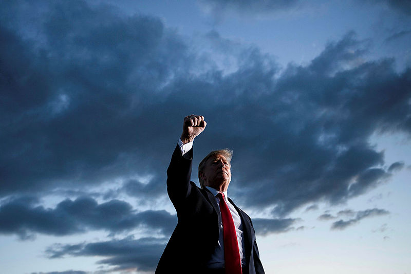 US President Donald Trump holds up his fist as he leaves after speaking during a Make America Great Again rally at Williamsport Regional Airport May 20, 2019, in Montoursville, Pennsylvania. — AFP