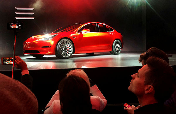A Tesla Model 3 sedan, its first car aimed at the mass market — Reuters