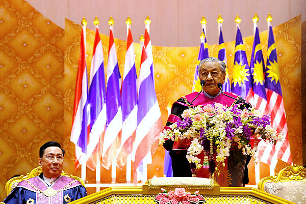 Prime Minister Tun Dr Mahathir Mohamad receives an honorary doctorate degree in social leadership, business and politics from Rangsit University, Bangkok on Dec 16, 2018. — Bernama