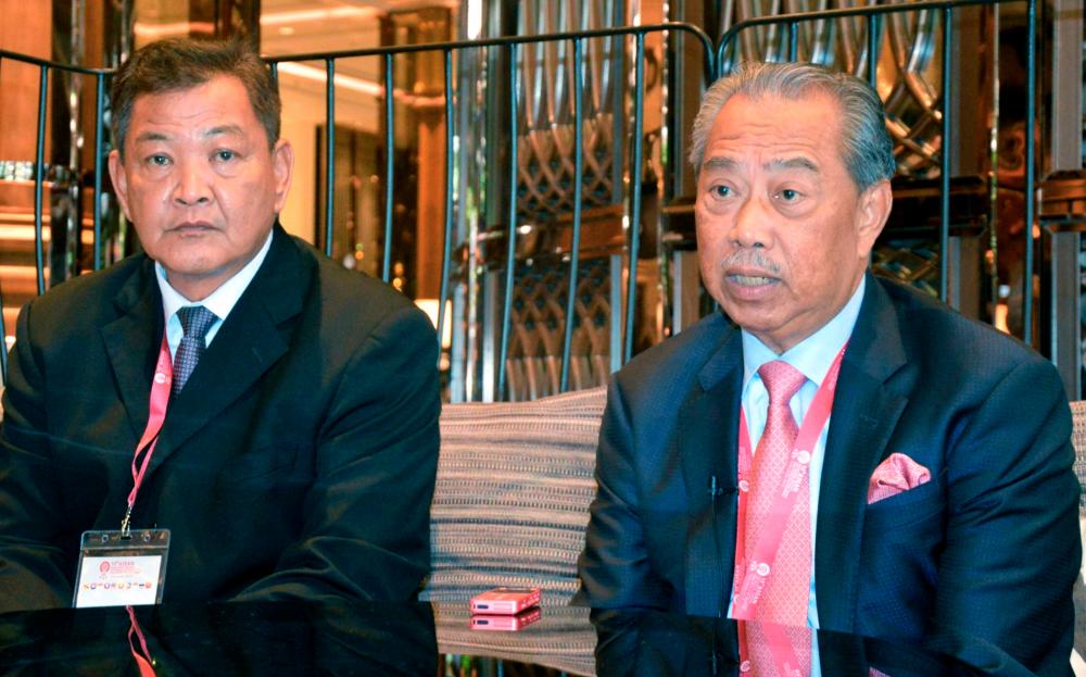 Home Minister Tan Sri Muhyiddin Yassin (R) with Inspector-General of Police Tan Sri Abdul Hamid Bador at an interview with Bernama after the Asean Ministers’ AMMTC meeting in Bangkok today. - Bernama