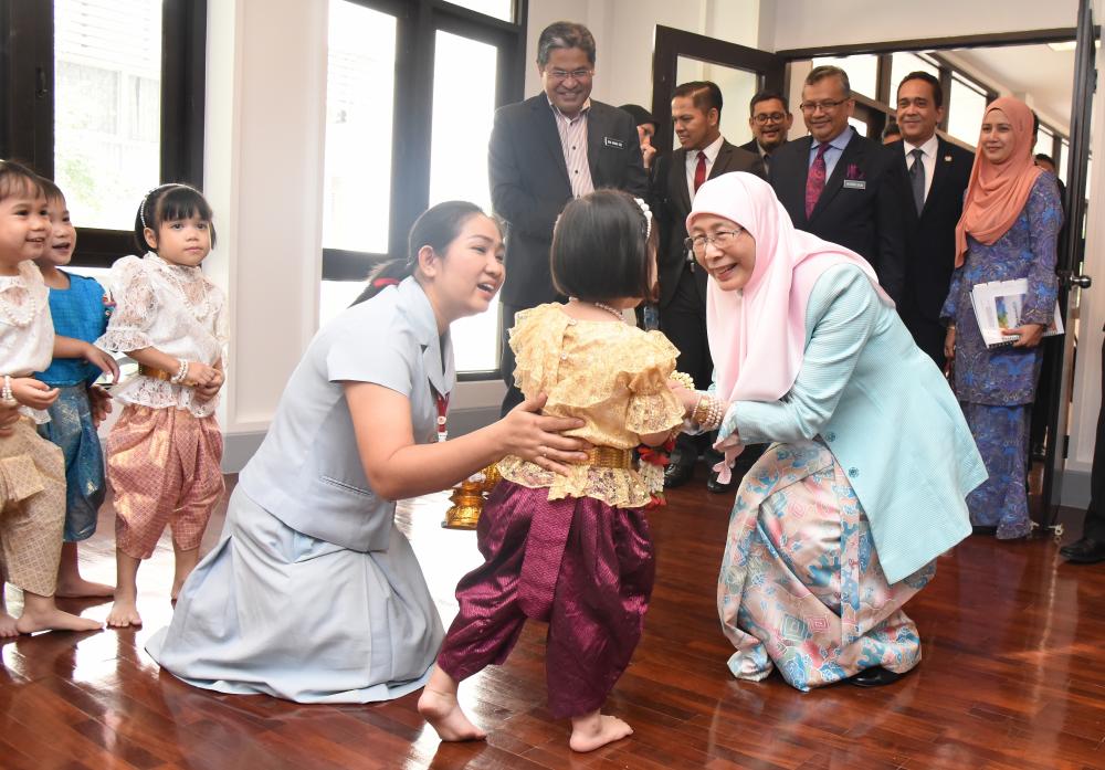 Deputy Prime Minister Datuk Seri Dr Wan Azizah Wan Ismail having a light moment with a child during her visit to the Thai Red Cross Children’s Home here to observe the facilities and child-care system for the underprivileged here, on Jan 24, 2018. — Bernama