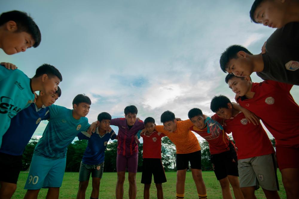 The Wild Boar soccer team and coach Eak entered the cave after playing a game. – ALL PIX BY NETFLIX