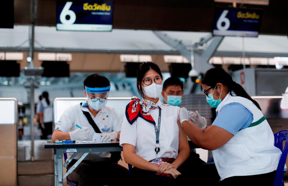 People get vaccinated against the coronavirus disease (Covid-19) at Suvarnabhumi airport in Bangkok, Thailand April 28, 2021. — Reuters