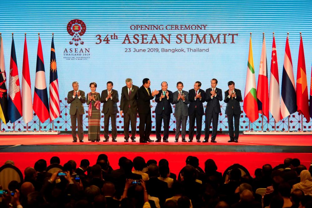 (From left) Malaysia's Prime Minister Mahathir Mohamad, Myanmar's State Counsellor Aung San Suu Kyi, Philippines' President Rodrigo Duterte, Singapore's Prime Minister Lee Hsien Loong, Thailand's Prime Minister Prayut Chan-O-Cha, Vietnam's Prime Minister Nguyen Xuan Phuc, Brunei's Sultan Hassanal Bolkiah, Cambodia's Prime Minister Hun Sen, Indonesia's President Joko Widodo and Laos Prime Minister Thongloun Sisoulith pose for photos during the opening ceremony of the 34th Association of Southeast Asian Nations (Asean) summit in Bangkok on June 23, 2019. — AFP
