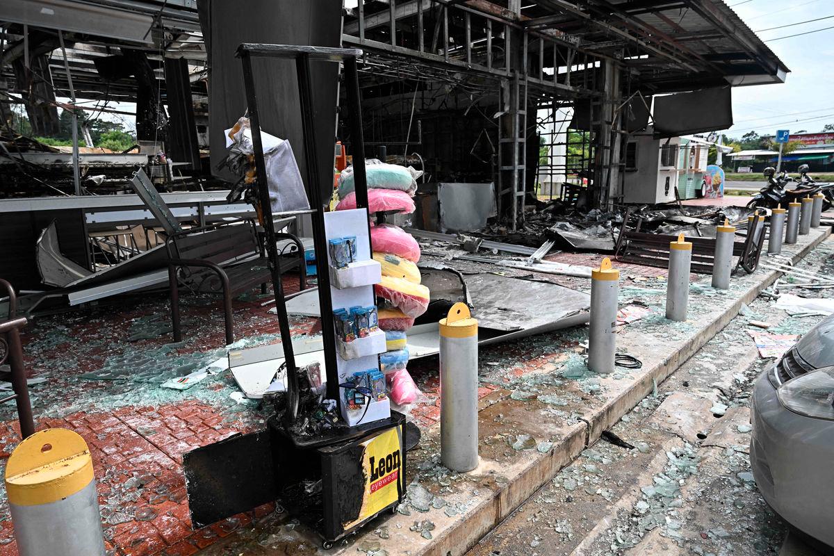 Damage from a fire caused by Cambodian artillery at a 7-11 convenience store is seen at a PTT gas station in the Thai border province of Sisaket province on July 25, 2025. - AFPPix