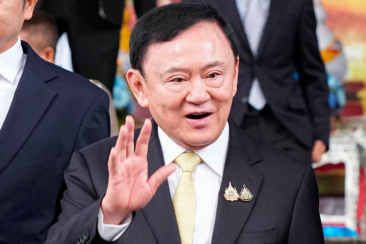 Thailand’s former prime minister Thaksin Shinawatra leaves the Criminal Court in Bangkok on August 22, 2025. Thaksin said he was acquitted on August 22 of royal defamation charges, relieving him of a threat to his faltering dynasty which has dominated politics for two decades. (Photo by Chanakarn Laosarakham / AFP)
