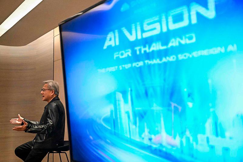 Jensen Huang, CEO and founder of Nvidia, which makes chips used to train artificial intelligence technology, speaks with members of the media during the Siam.AI Cloud event in Bangkok on December 4, 2024. - Lillian SUWANRUMPHA / AFP