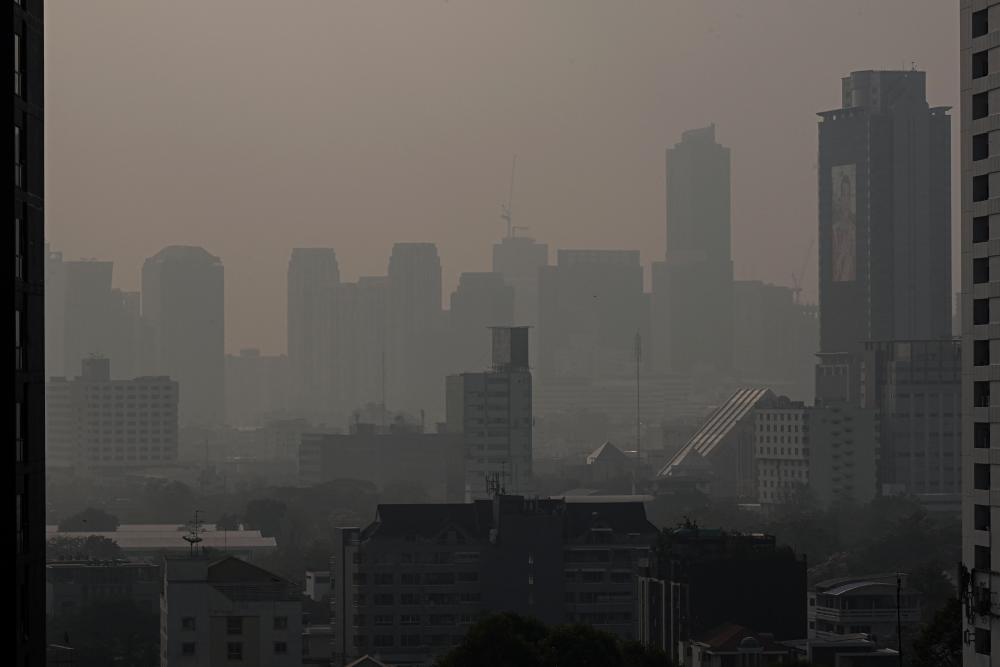 Skyscrapers are seen amid high air pollution levels in Bangkok on February 15, 2023. - AFPPIX
