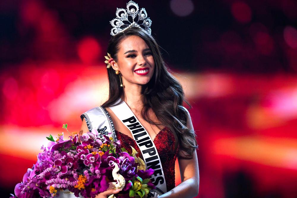 Catriona Gray of the Philippines smiles after being crowned the new Miss Universe 2018 on Dec 17, 2018 in Bangkok. — AFP