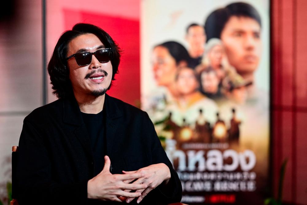 Thai director of the upcoming Netflix series Thai Cave Rescue, Nattawut 'Baz' Poonpiriya speaks during an interview with AFP in Bangkok on September 20, 2022. - AFPPIX