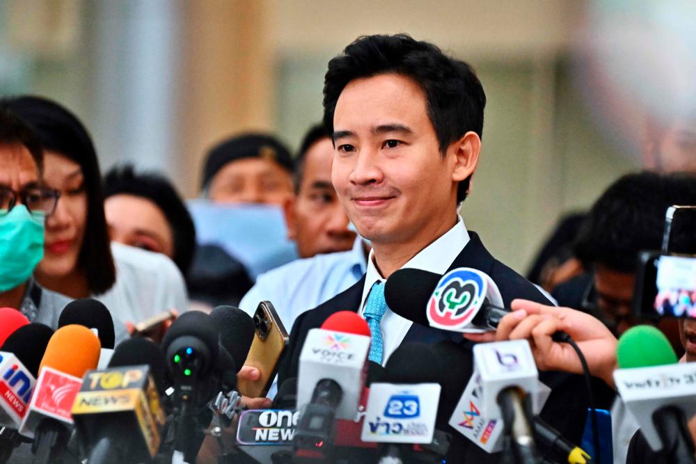 Former Thai prime ministerial candidate and ex-Move Forward Party leader Pita Limjaroenrat speaks to media as he leaves a hearing regarding his ownership of media shares at the Constitutional Court in Bangkok on December 20, 2023/AFPPix