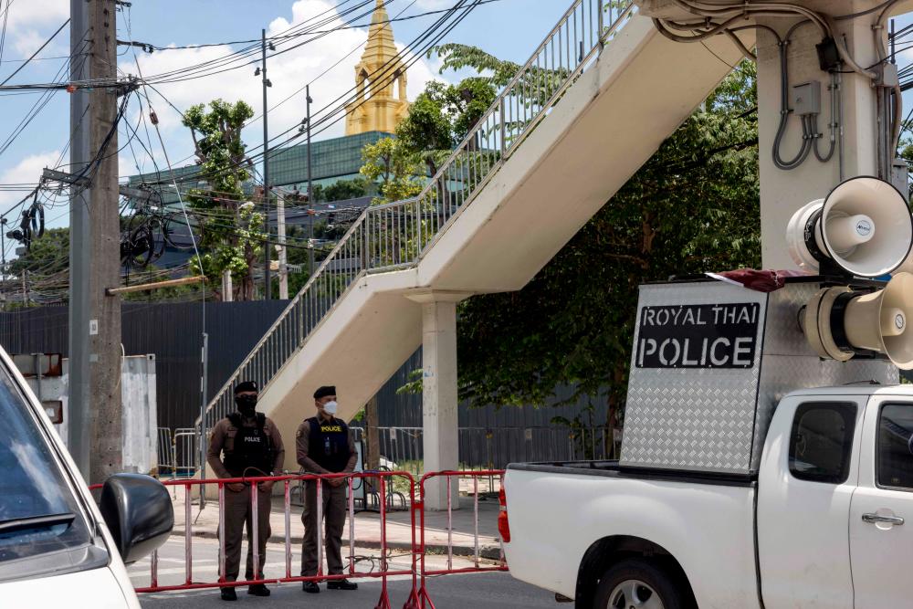 Police officers stand between barriers outside the Thai Parliament ahead of planned pro-democracy protests during the parliamentary vote to decide the country’s next prime minister in Bangkok on July 13, 2023/AFPPix