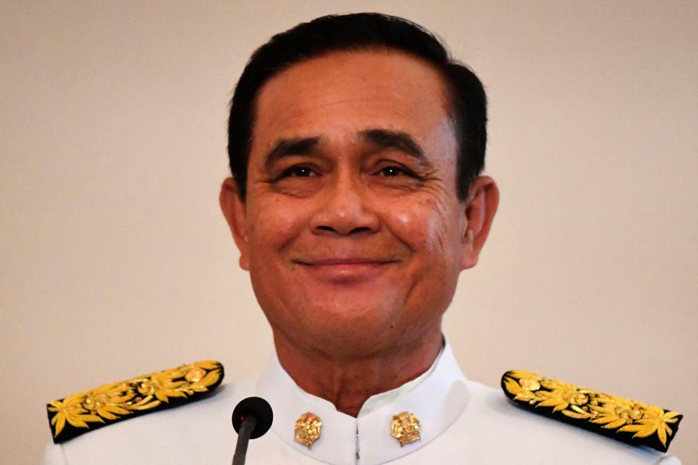 Prayut Chan-O-Cha smiles after the royal endorsement ceremony appointing him as Thailand’s new prime minister at Government House in Bangkok on June 11, 2019. — AFP