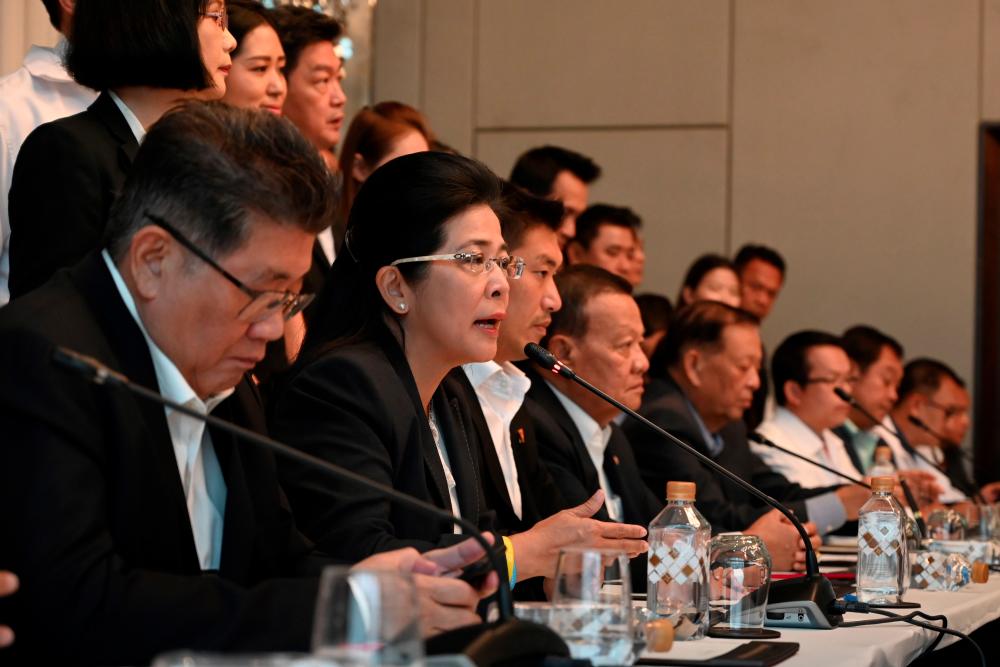 Pheu Thai party leader Sudarat Keyuraphan (L2) speaks during a joint press conference with other political party leaders in Bangkok on March 27, 2019. — AFP