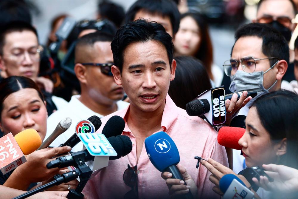 Move Forward Party leader and prime ministerial candidate Pita Limjaroenrat speaks to the press after casting his ballot at a polling station during Thailand’s general election in Bangkok on May 14, 2023/AFPPix