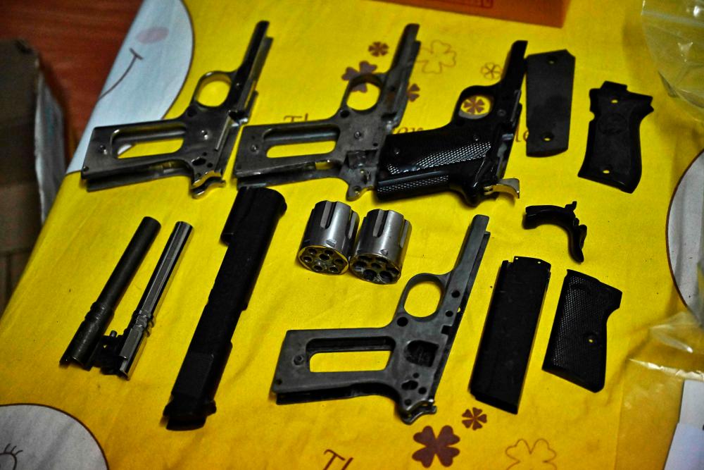 Gun parts are put on display at a home raided by Thai police in Bangkok on October 5, 2023 as part of a police crackdown on illegal gun sales following a shooting attack at Bangkok Siam Paragon mall/AFPPix