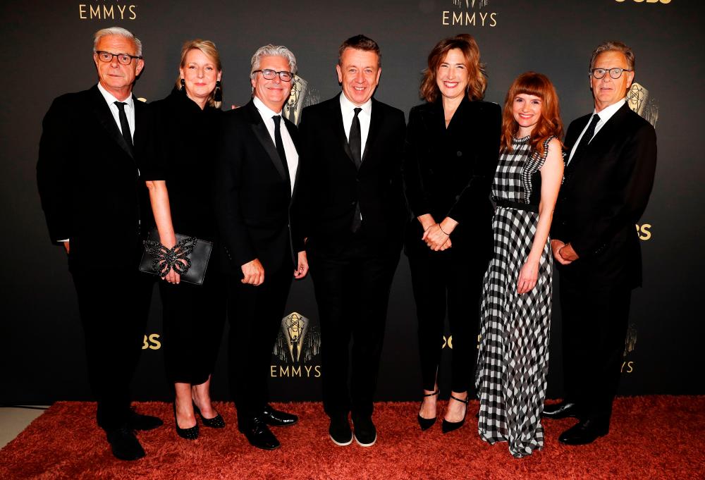 Showrunner Peter Morgan, Director Jessica Hobbs, Executive Producers Stephen Daldry, Robert Fox, Matthew Byam Shaw and Suzanne Mackie, and Producer Oona O’Beirn, pose at the Netflix UK Primetime Emmy Red Carpet for “The Crown“ in London, Britain/REUTERSPix