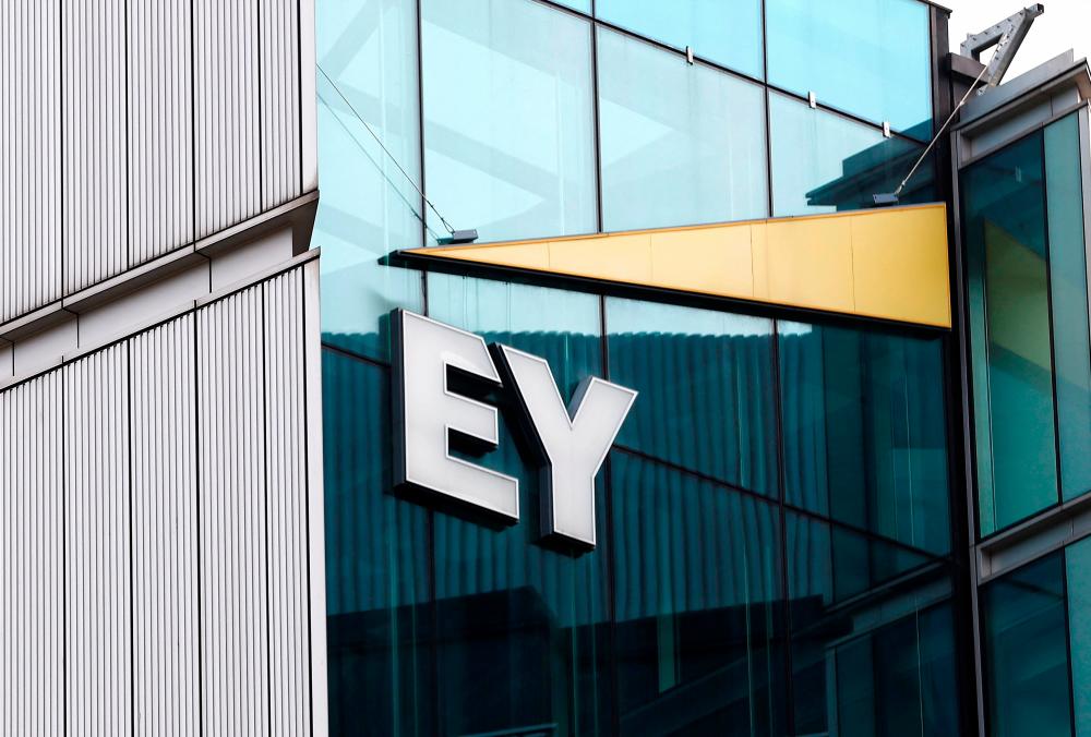 The EY logo is seen at the firm’s headquarters in London. – Reuterspic