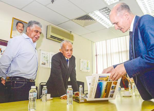Abdelhafid briefing Navjeet and Azman on attractions in Algeria during his visit yesterday. – THESUNPIX