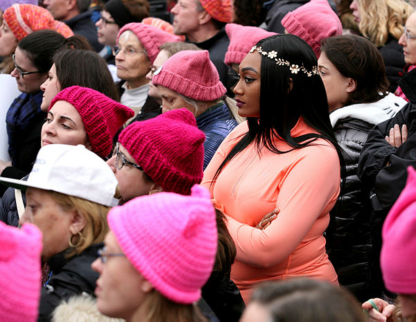 People listen to speeches at the Women’s March in opposition to the agenda and rhetoric of President Donald Trump Washington. — Reuters