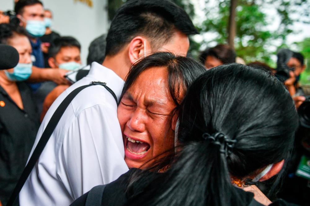 Prim Boonpattararaksa, mother of anti-government protester Jatupat Pai Daodin Boonpattararaksa, reacts after her son was denied bail and transferred to prison after being charged with insulting the monarchy, at the Criminal court in Bangkok, Thailand, March 8, 2021. — Reuters