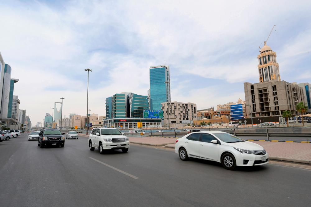 General view shows the cars on the street, after curfew lifted, which was imposed to prevent the spread of the coronavirus disease (COVID-19), in Riyadh, Saudi Arabia, March 24, 2020. - Reuters
