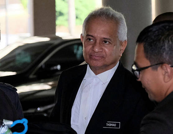 Ex-AG denies dropping money laundering charges against Riza Aziz